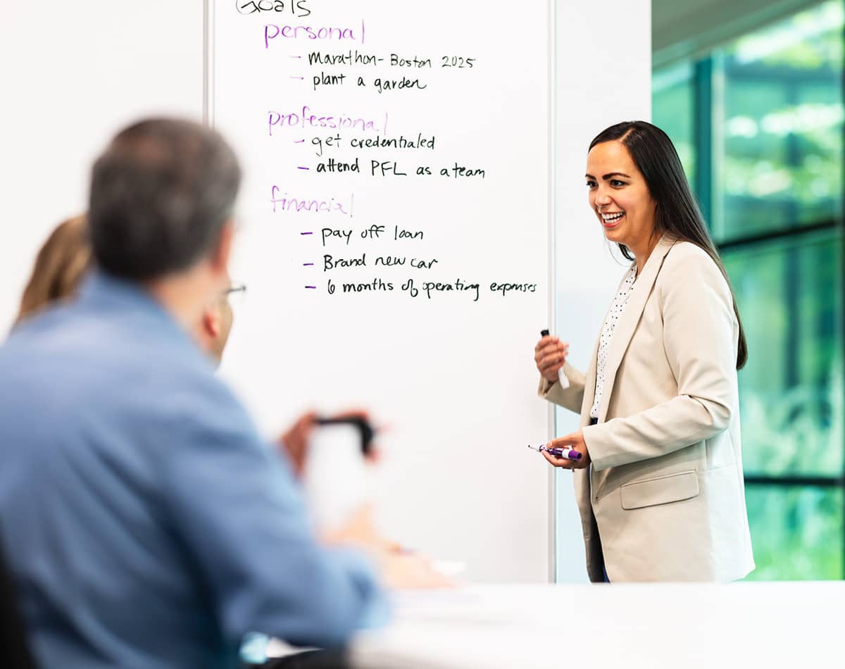 Woman standing at a whiteboard