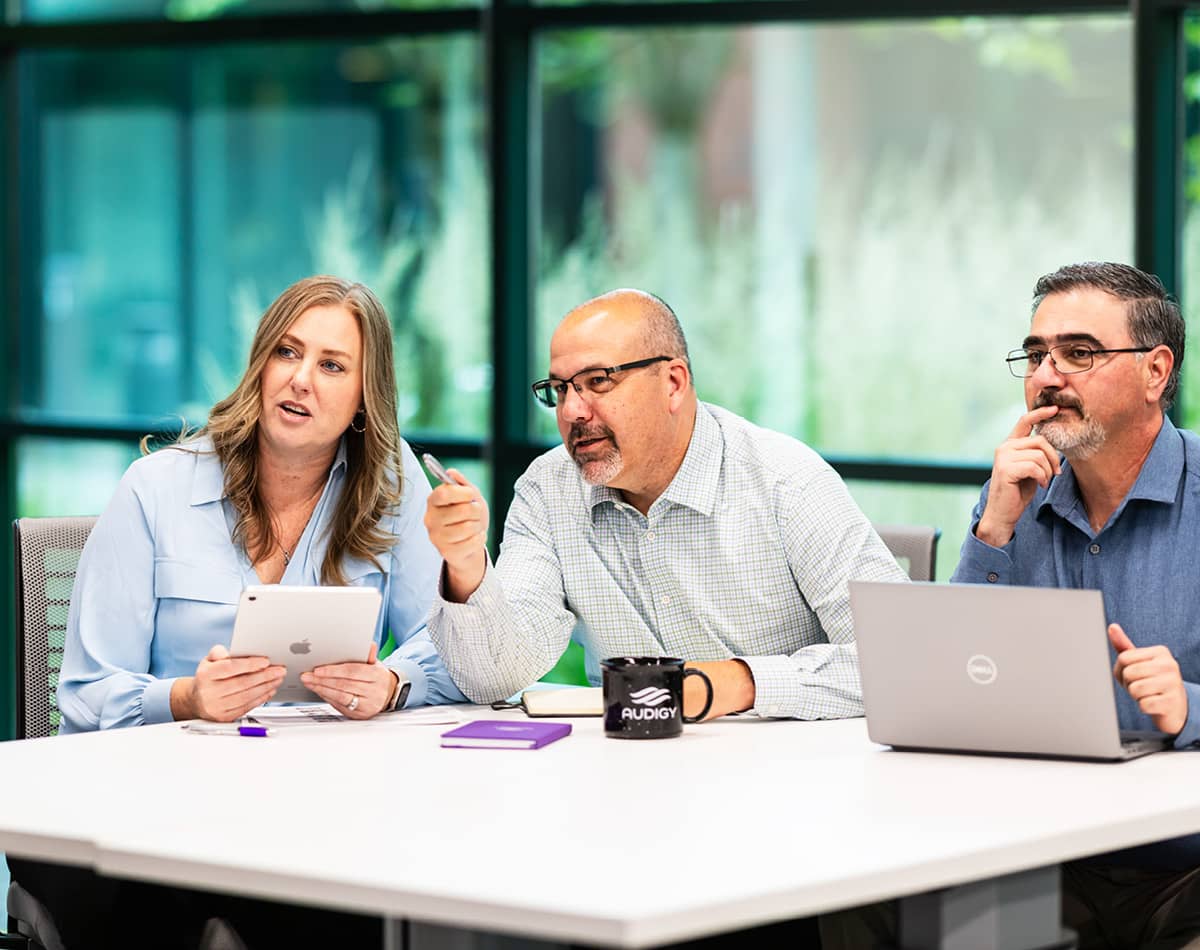 Three professionals meeting