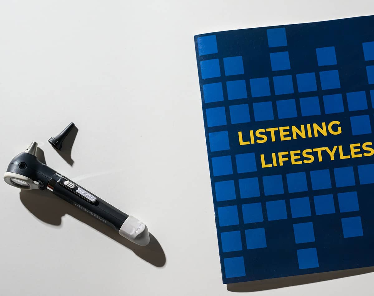 An otoscope and a booklet labelled Listening Lifestyles