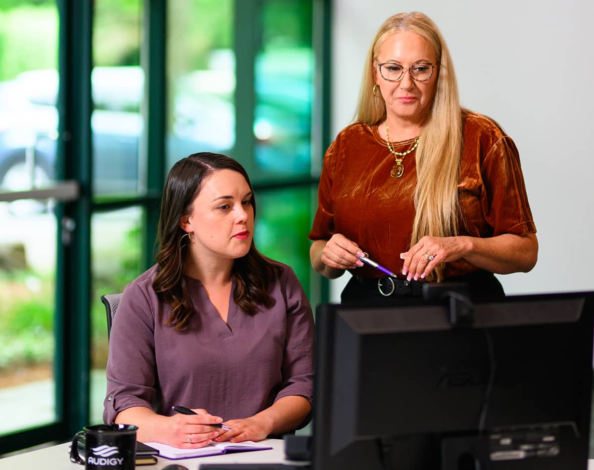 Two professional women meeting at a computer