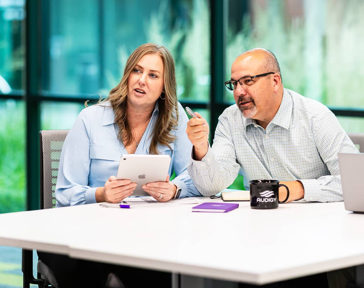 Two professionals meeting at a table