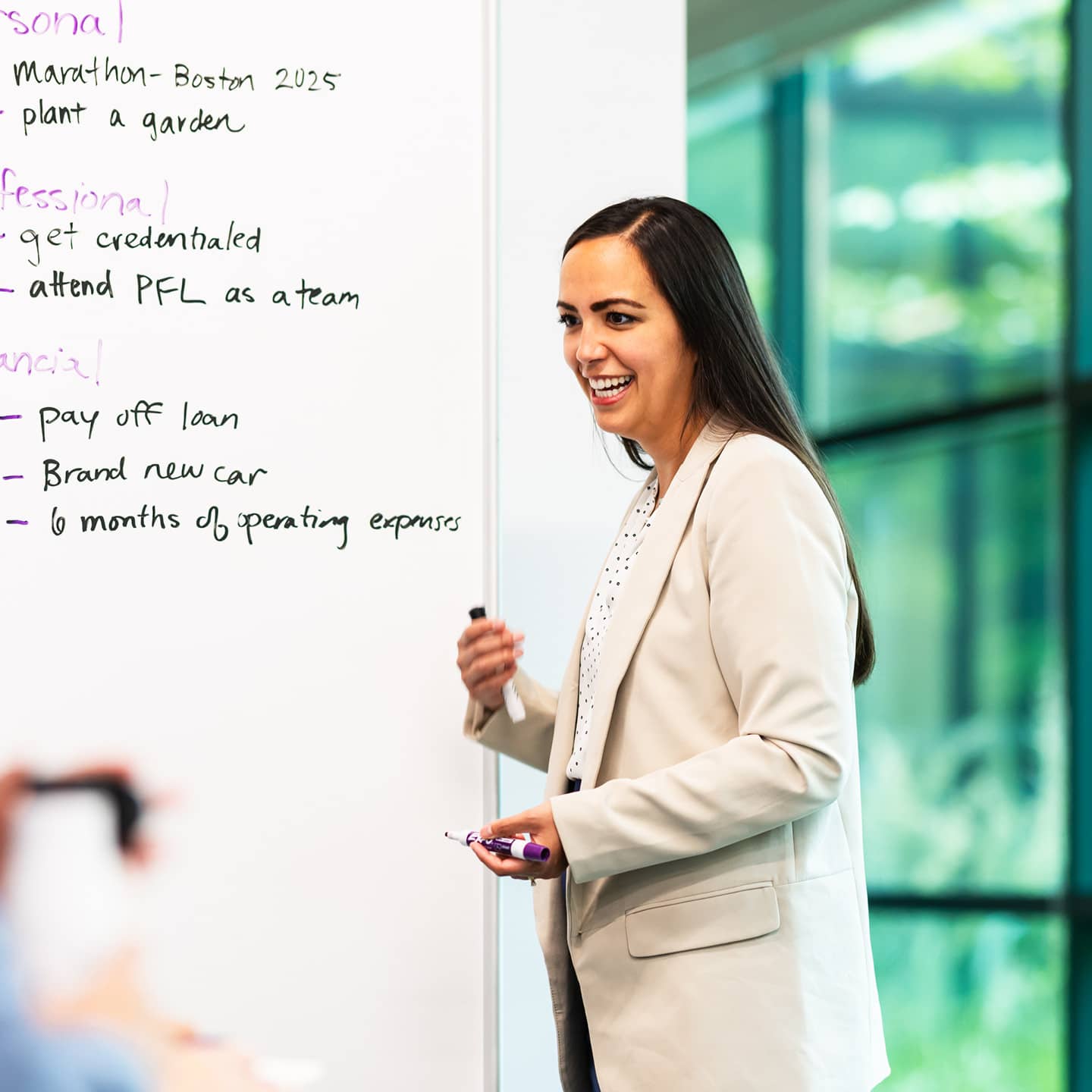 Woman standing at a whiteboard