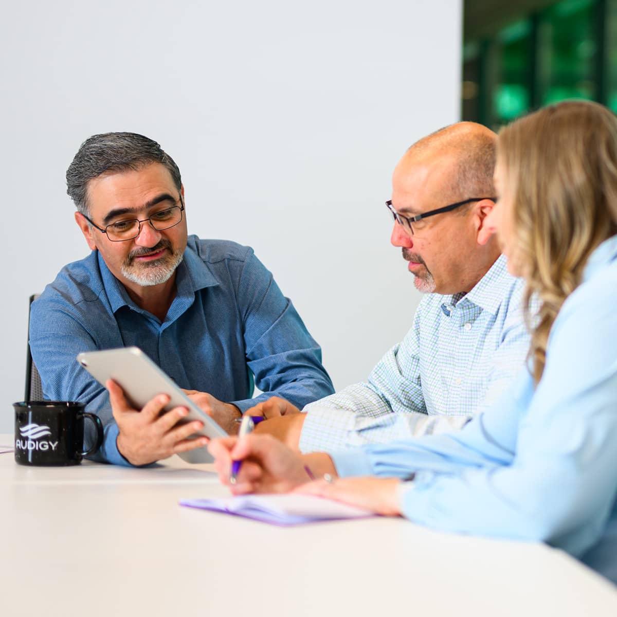 Three professionals in discussion