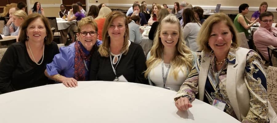 A Team of hearing care professionals attending a team professional development training.